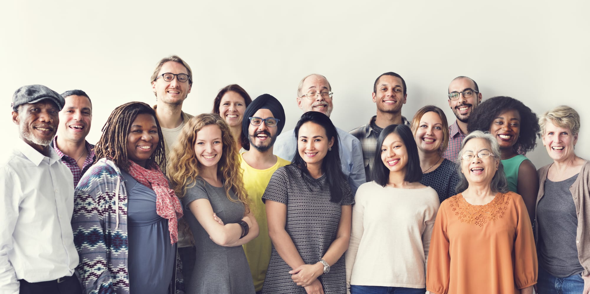 A diverse group of people smiling for a photo