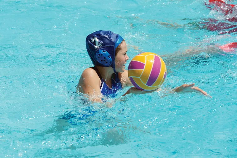 Youth girl playing water polo