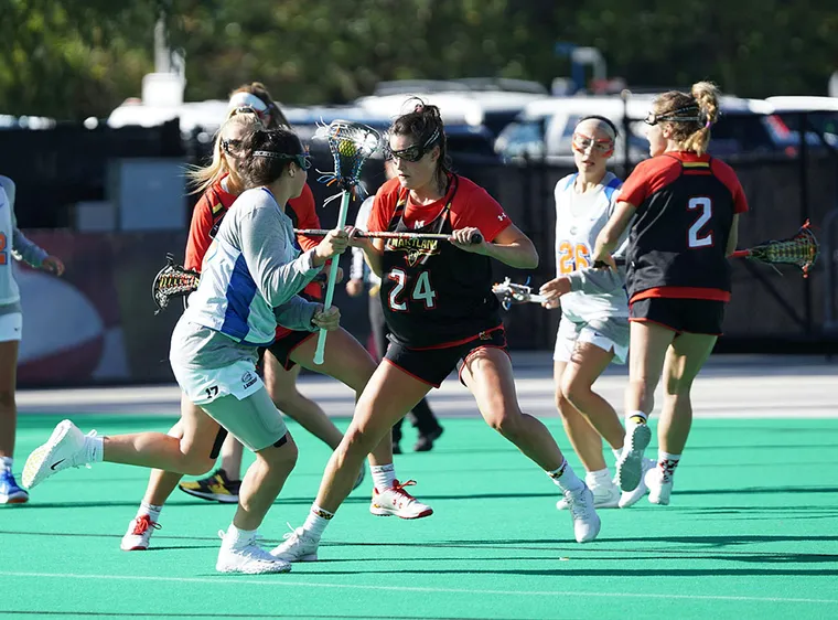 Womens lacrosse team playing a game