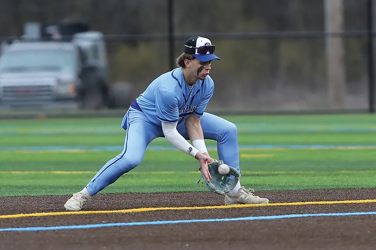 Baseball player fielding a ball